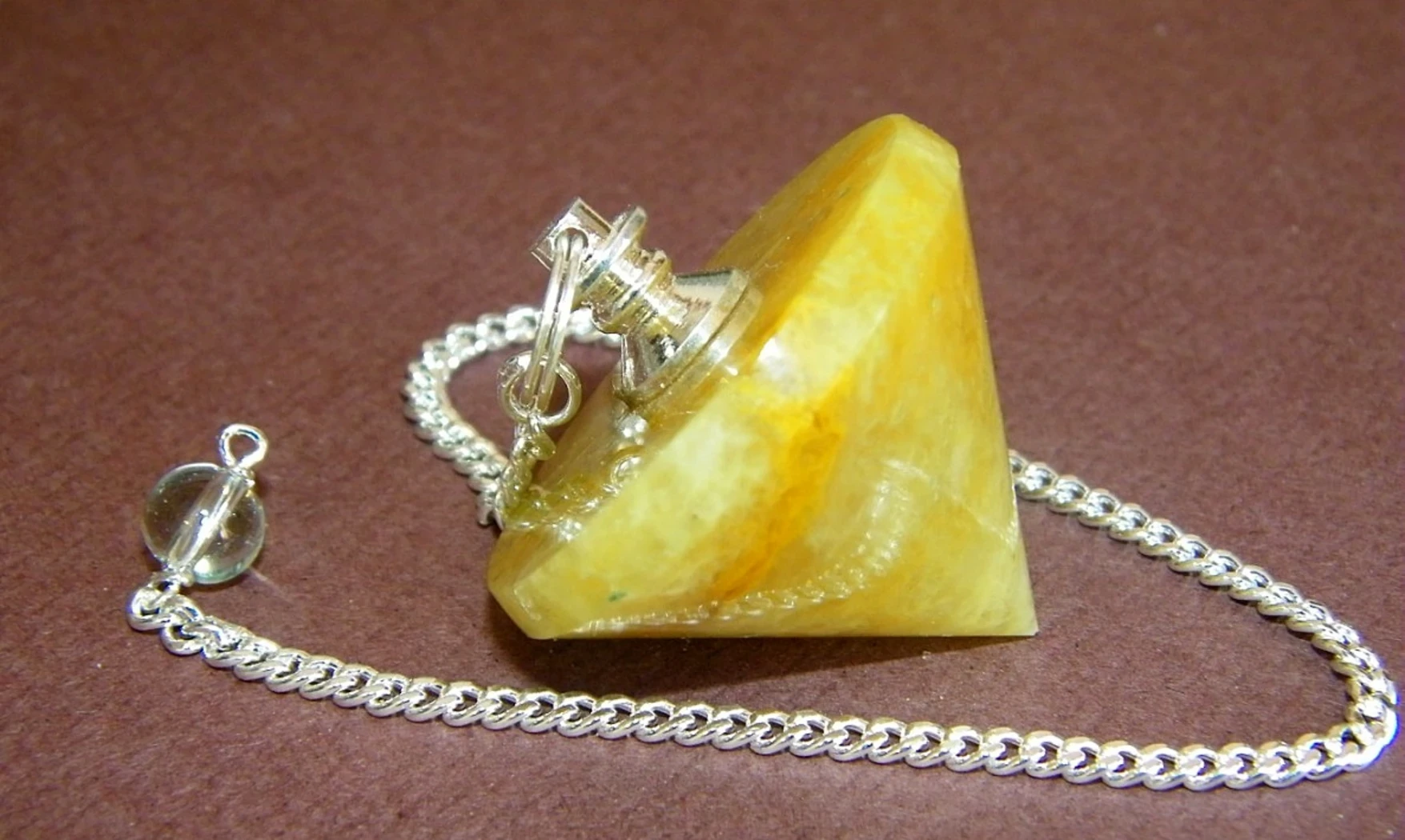 Calcite orange pierre Toupie pendule