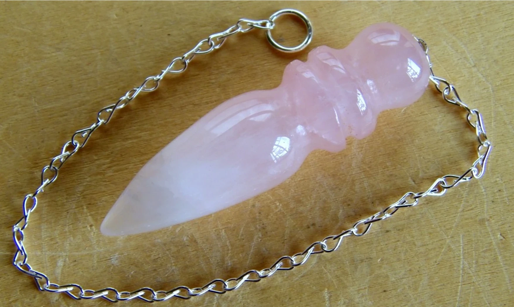 Quartz rose pendule Égyptien pierre