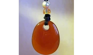 Cornelian drilled stone pendant