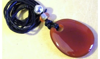 Cornelian drilled stone pendant