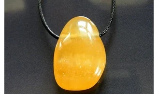 Orange Calcite stone drilled pendant